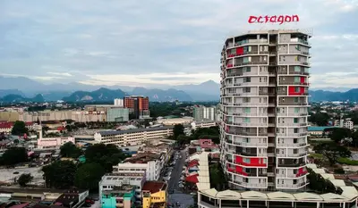 a tall building with a sign on the side of it at H2H - Octagon Cottage at Ipoh Town Center in Ipoh