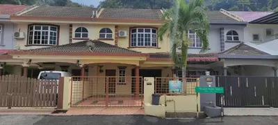 a house with a fence in front of it at Afamily Homestay in Ipoh