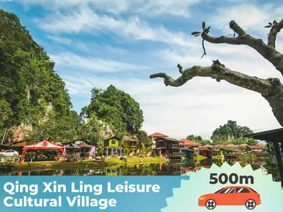 a picture of a village with a car in a tree at Afamily Homestay in Ipoh