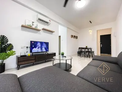 a living room with a couch and a table at Ipoh Cove Premium Suites by Verve in Ipoh