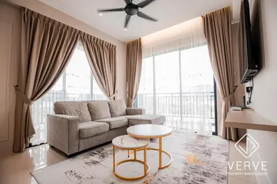 a living room with a couch and a table at Ipoh Cove Premium Suites by Verve in Ipoh