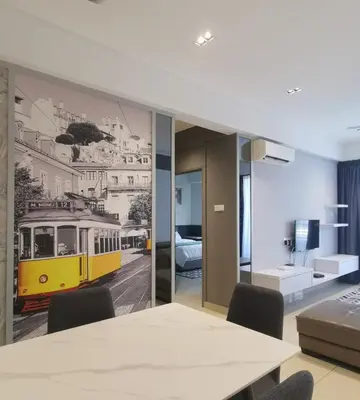 a dining room with a yellow train mural on the wall at New Ipoh The Majestic Condo Homestay in Ipoh