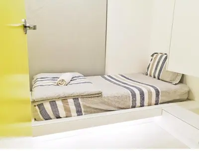 a reflection of a bed in a mirror at Deluxe & Feel Like a Home 2, 3-6pax, Netflix, Georgetown in Jelutong