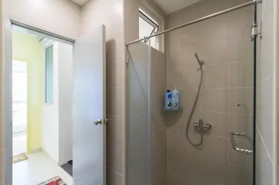a bathroom with a shower with a glass door at Deluxe & Feel Like a Home 2, 3-6pax, Netflix, Georgetown in Jelutong