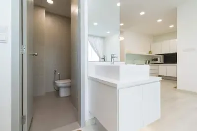 a white bathroom with a sink and a toilet at Deluxe & Feel Like a Home 2, 3-6pax, Netflix, Georgetown in Jelutong