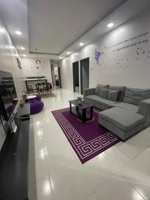 a living room with a couch and a purple rug at Cameron Lavender Homestay 3 in Tanah Rata