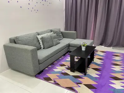 a living room with a couch and a table at Cameron Lavender Homestay 3 in Tanah Rata