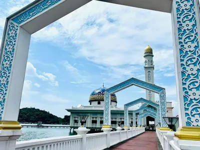 a building with a mosque in the middle of the water at Kejora Garden Resort Pulau Pangkor in Pasir Bogak