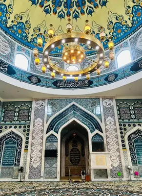 a building with a ceiling with a chandelier at Kejora Garden Resort Pulau Pangkor in Pasir Bogak