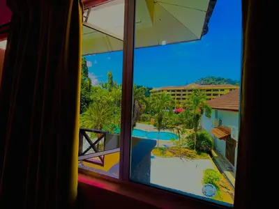a view of a pool from a window at Kejora Garden Resort Pulau Pangkor in Pasir Bogak