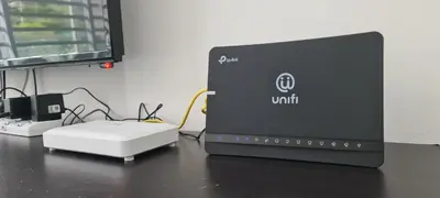 a laptop computer sitting on top of a desk at The Simplicity Homestay in Tanah Rata