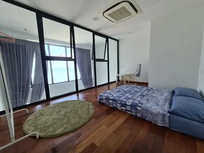 a bedroom with a bed and a large window at Sunrise Gurney Premium Executive City/Seafront suite - Penang in George Town