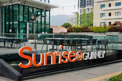 a sunoco sign on the side of a building at Sunrise Gurney Premium Executive City/Seafront suite - Penang in George Town