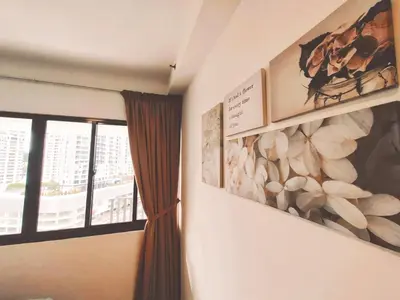 a room with two paintings on the wall and a window at THE LANDMARK BY KATANA New 3BR Grand Seaview Homestay at Gurney \u65e0\u654c\u6d77\u666f\u4e09\u623f\u5957\u623f in Tanjung Bungah