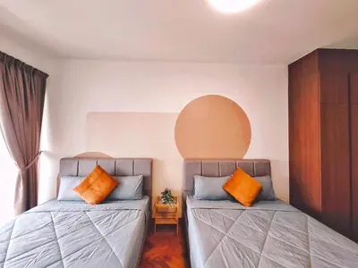 two beds sitting next to each other in a room at THE LANDMARK BY KATANA New 3BR Grand Seaview Homestay at Gurney \u65e0\u654c\u6d77\u666f\u4e09\u623f\u5957\u623f in Tanjung Bungah