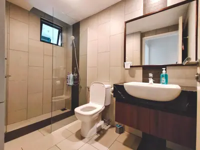 a bathroom with a toilet and a sink and a mirror at THE LANDMARK BY KATANA New 3BR Grand Seaview Homestay at Gurney \u65e0\u654c\u6d77\u666f\u4e09\u623f\u5957\u623f in Tanjung Bungah