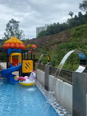 a water park with a pool with a inflatable animal on a raft at 50PAX 9BR Villa Kids Swimming Pool, KTV, BBQ n Pool Tables near SPICE Arena Penang 9800 SQFT in Bayan Lepas