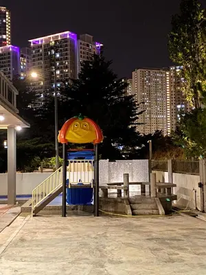 a playground with a smiley face on it at night at 18PAX 4BR Villa with Kids Swimming Pool, KTV, BBQ near SPICE Arena Penang in Bayan Lepas