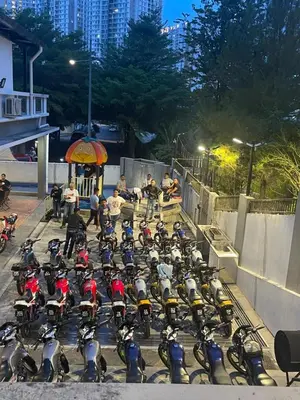 a group of motorcycles parked in a parking lot at 30PAX 7BR Villa with Kids Swimming pool, KTV, Pool Table n BBQ near SPICE Arena Penang 9800 SQFT in Bayan Lepas