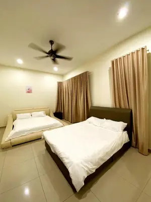 two beds in a bedroom with a ceiling fan at 40 PAX 9BR Villa with Kids swimming Pool, KTV, BBQ n Pool Tables near SPICE Arena Penang 9800 SQFT in Bayan Lepas