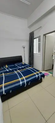 a bedroom with a blue and white bed with a window at Cameron 3room Golden Hills in Brinchang