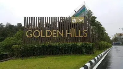 a sign on a wooden fence next to a river at Cameron 3room Golden Hills in Brinchang