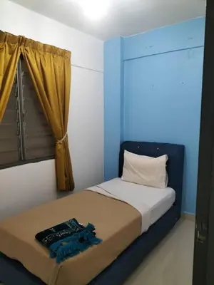 a bed in a room with a window and a bedvisor at Homestay pangsapuri sutera seberang jaya in Kampong Telok