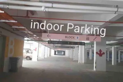 an empty parking lot with a sign for indoor parking at #CameronHighlands homestay in Brinchang