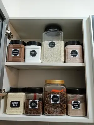 a pantry filled with lots of jars of food at HOMESTAY SYAABAN Kamunting Taiping Batu Kurau Ulu Sepetang in Kamunting