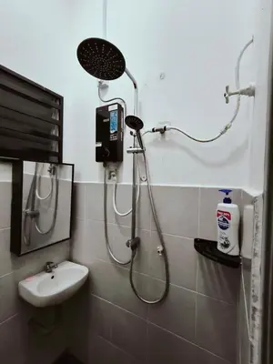 a bathroom with a shower and a sink at HOMESTAY SYAABAN Kamunting Taiping Batu Kurau Ulu Sepetang in Kamunting