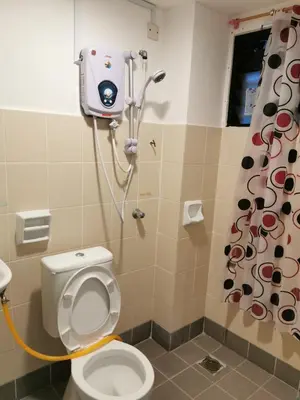 a bathroom with a toilet with a camera on the wall at C 13 Lot 10 Pangkor Leisure Beach Studio in Pangkor