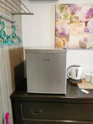 a white appliance sitting on top of a dresser at C 13 Lot 10 Pangkor Leisure Beach Studio in Pangkor