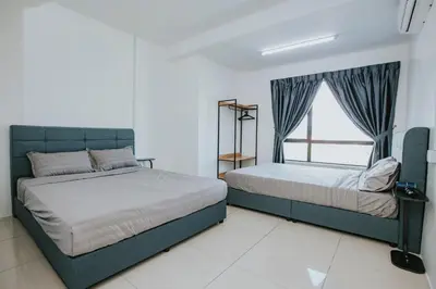 a bedroom with two beds and a window at Ipoh Manhattan Premium Suites by Verve in Ipoh