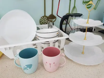 a group of coffee mugs sitting on a table at Mansion One Suite by stayCATion Homestay in George Town