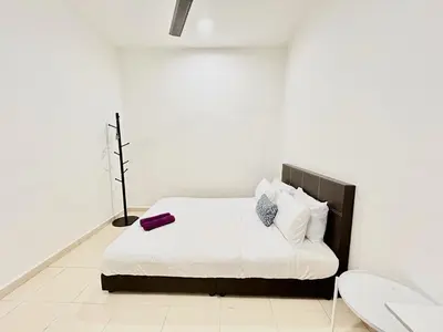 a white bedroom with a white bed with a purplevisorvisorvisor at Cozy 288 Entire 3 bedroom House @ Alma Bukit Mertajam in Bukit Mertajam