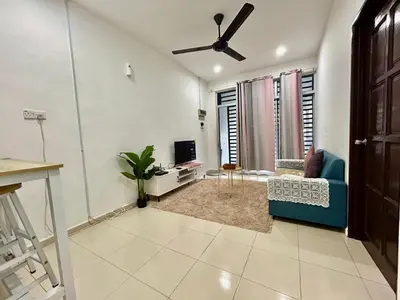 a living room with a blue couch and a ceiling fan at Cozy 288 Entire 3 bedroom House @ Alma Bukit Mertajam in Bukit Mertajam