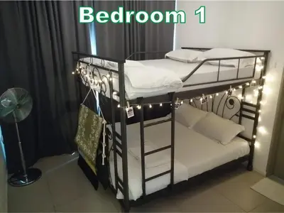 a couple of bunk beds with lights on them at D&C Homestay A Modern Forest Boutique in Brinchang