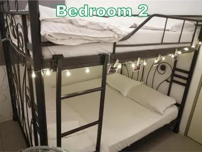 a black bunk bed with lights on it at D&C Homestay A Modern Forest Boutique in Brinchang