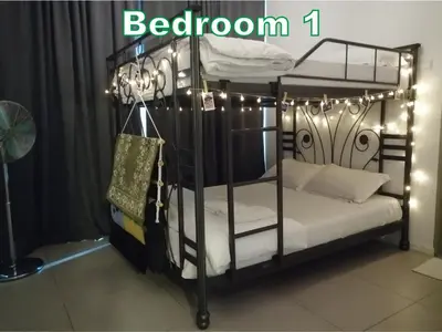 a black bunk bed with lights on top of it at D&C Homestay A Modern Forest Boutique in Brinchang