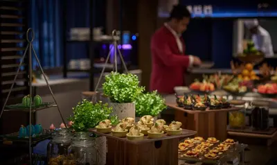 a buffet of food on display in a restaurant at Amari SPICE Penang in Bayan Lepas