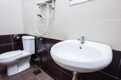 a bathroom with a sink and a toilet at Value Inn Homestay in Butterworth