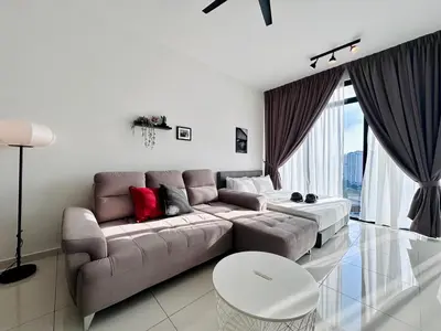 a living room with a couch and a table at Bali-style 2Bedroom Beacon Georgetown WL in George Town