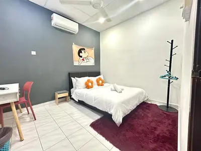 a bedroom with a bed with two teddy bears on it at Cozy Murni 14th Entire 3 Bedroom House at Alma Bkt Mertajam in Bukit Mertajam