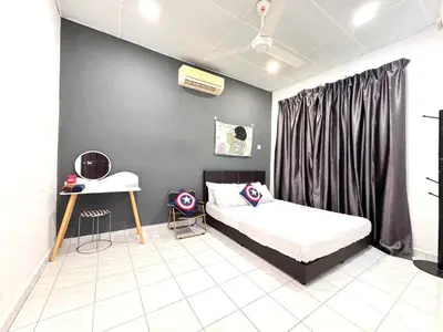 a bedroom with a bed and a desk in it at Cozy Murni 14th Entire 3 Bedroom House at Alma Bkt Mertajam in Bukit Mertajam