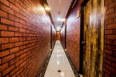 a corridor of a brick wall with a long corrideway at Surprised Homestay Butterworth in Butterworth