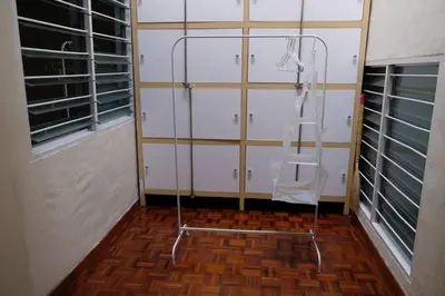 a room with a glass shower with a ladder at Simple Home Taiping \u7b80\u5c45 Lakeview in Taiping