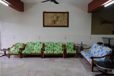 a waiting room with a row of chairs and tables at Simple Home Taiping \u7b80\u5c45 Lakeview in Taiping