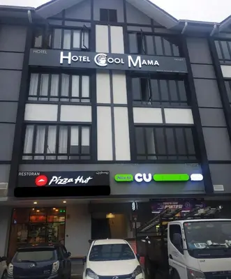 a hotel good mama with cars parked in front of it at Hotel COOL MAMA in Brinchang