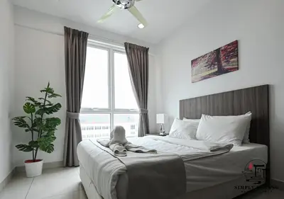 a bedroom with a bed with a large window at Mansion One by Simply Penang in George Town
