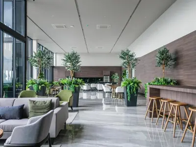 a lobby with couches and chairs and tables at BEACON LeNa #Seaview#RoofTopPool#6pax#Georgetown in George Town